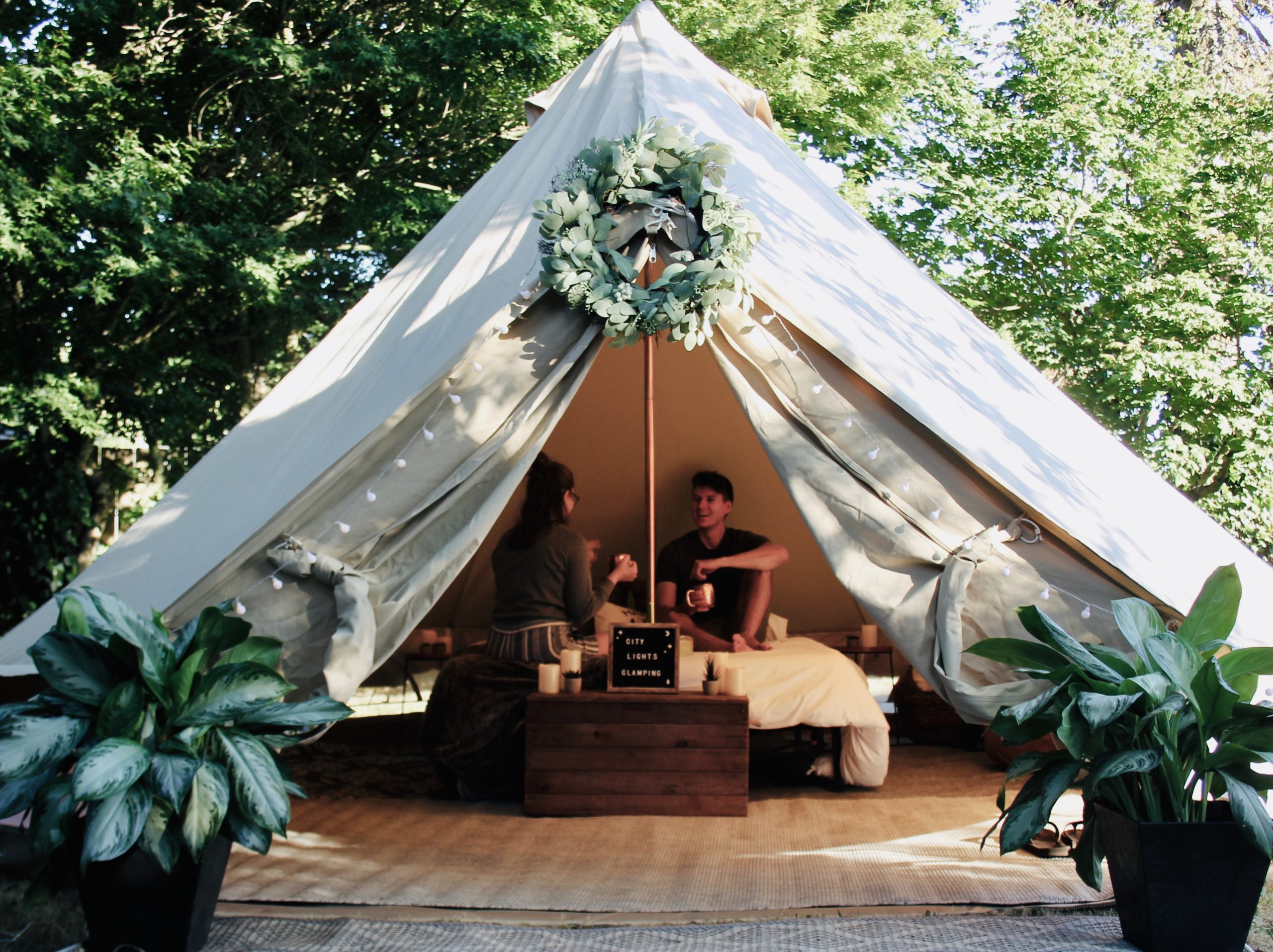 glamping tent with two people inside